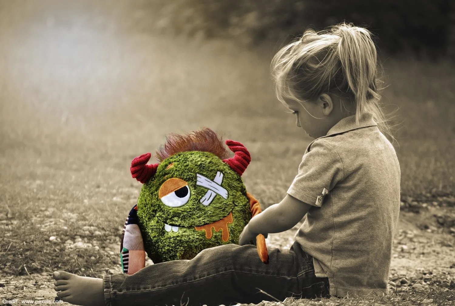 Child with stuffed toy representing childhood trauma